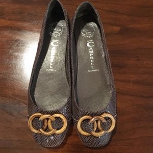 Brown snake skin Jeffrey Campbell shoes.