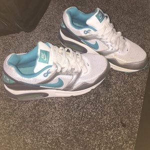 Nike teal AirMax navigates