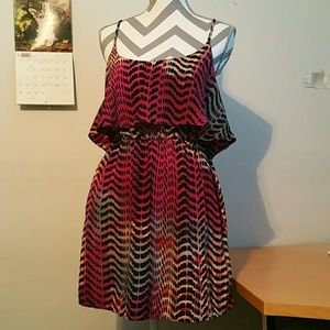 Colourful patterned dress with open back.