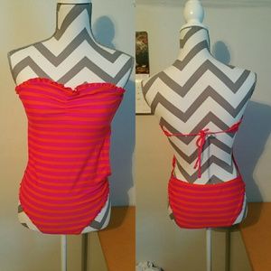 Pink and orange open back swimsuit.