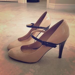 Nude patent leather heels with black sole