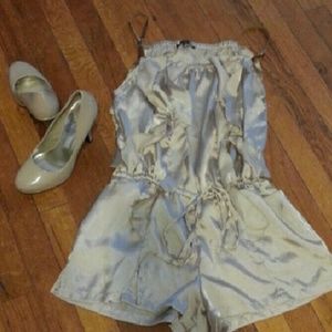 Silky romper with leather straps.