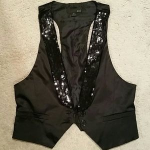 Black sequin vest. GREAT for holiday parties!!!