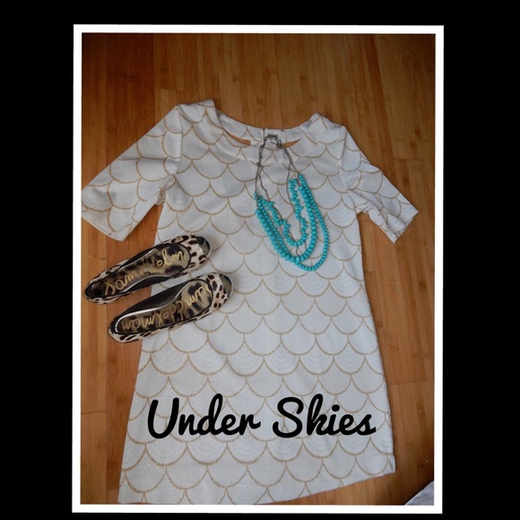 Under skies ivory and sparkle gold