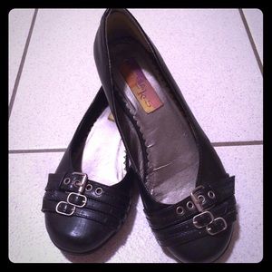 Black flats with buckle accents