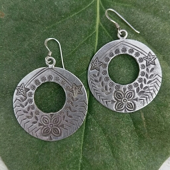 Intricate artist etched Silver earrings