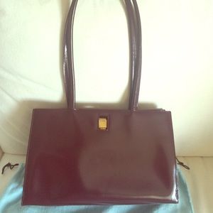 Furla Bordeaux color classic leather handbag.