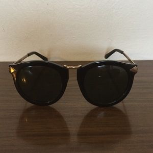 Karen Walker gold and black sunglasses