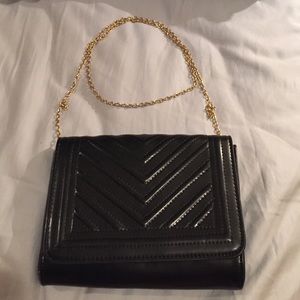Black cross body shoulder bag with gold chain