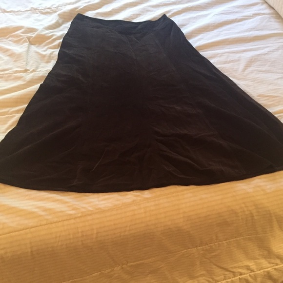 Dark brown, thin, soft, corduroy skirt.