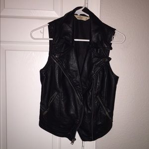 Black faux leather vest.