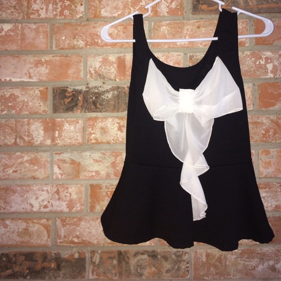 Black peplum top with white bow