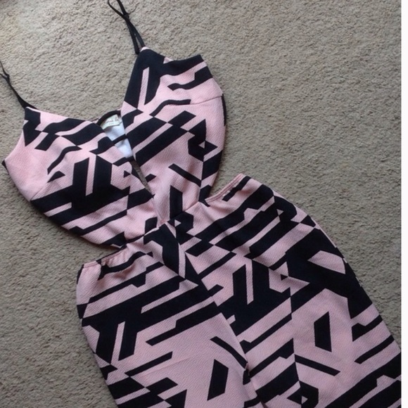 Reserved NWOT patterned body suit.