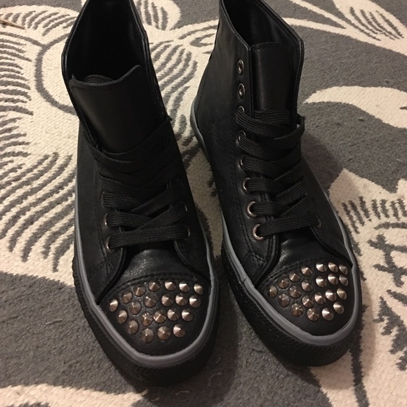 Black faux leather spiked sneakers