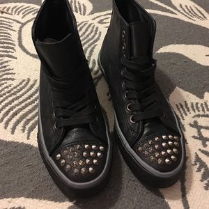 Black faux leather spiked sneakers
