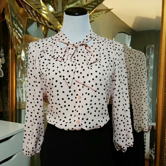 Pink with black  polk-a-dots blouse.