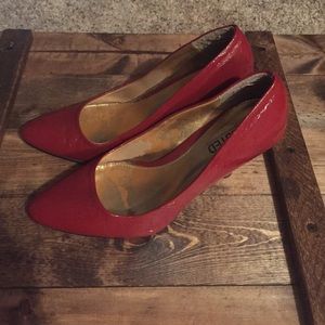 Red patent leather pumps
