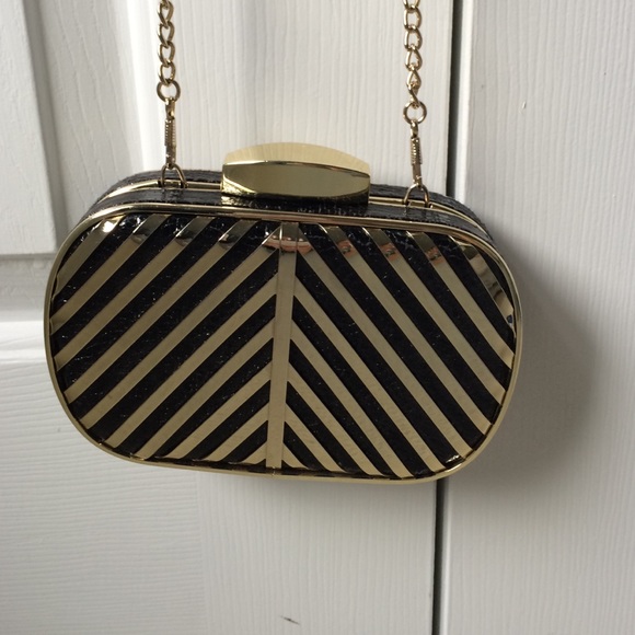 Black and gold hardcover wallet on chain bag