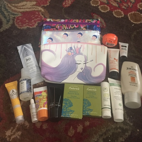Assorted bath and beauty product samples plus bags