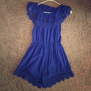 Blue juniors medium romper with lacy trim.