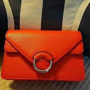 NWT super cute orange bag with sliver accents