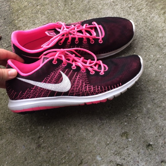 Pink and black pair of NIKE FLEX shoes