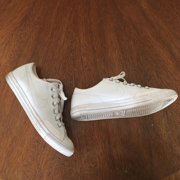 White faux-leather Nike sneakers.