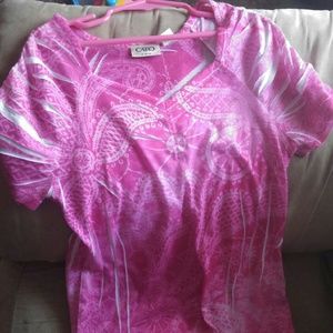 Pink and white shirt.