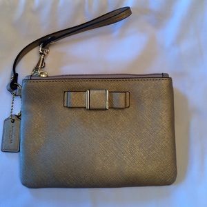 **REDUCED** Gold Coach Wristlet w Bow Detail NWOT