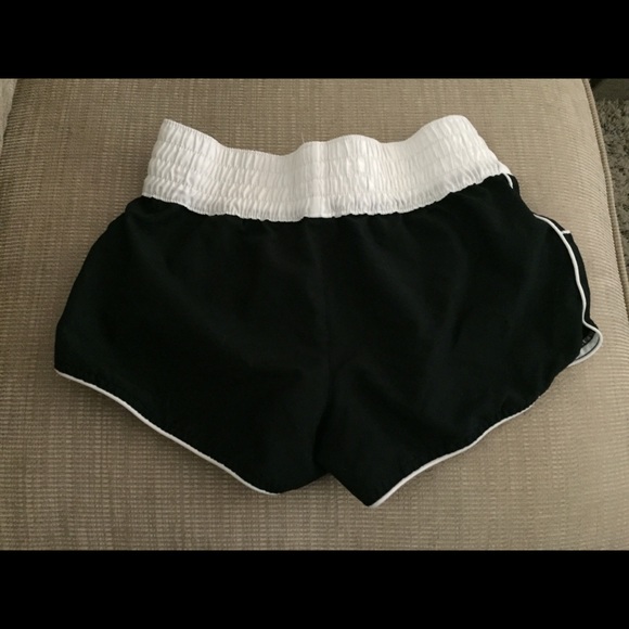 Black and white running shorts with pockets. - Picture 2 of 2
