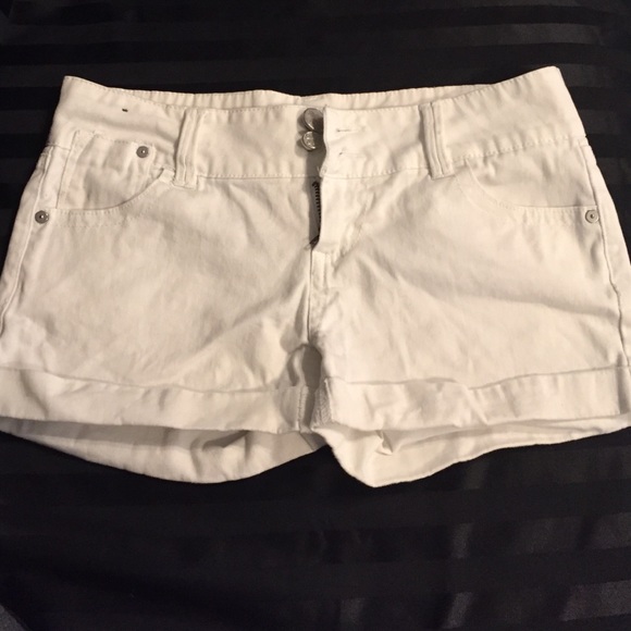 Double button up white jean shorts.