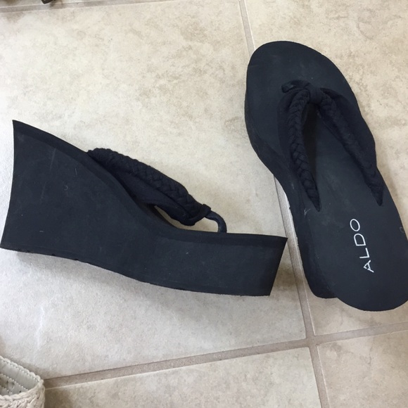 Black wedge sandals by Aldo