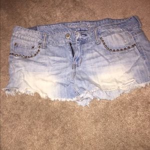 Distressed studded light blue jean shorts