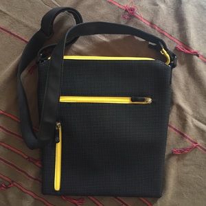 Urban Oxide black rubber cross body handbag