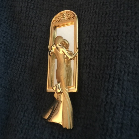 Beautiful pin gold lady looking n dressing  mirror