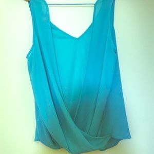 Turquoise sleeveless layered interlocked blouse