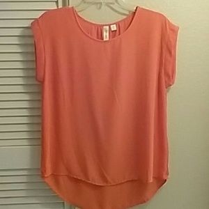 Bright orange blouse!