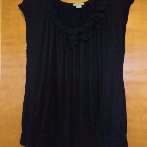 Cute black top with ruffle detail!