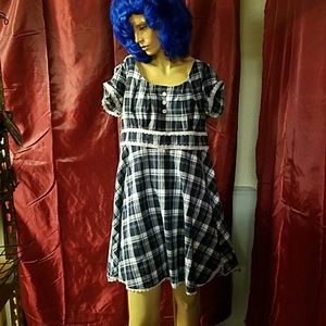 Blue plaid dress with white lace trim.