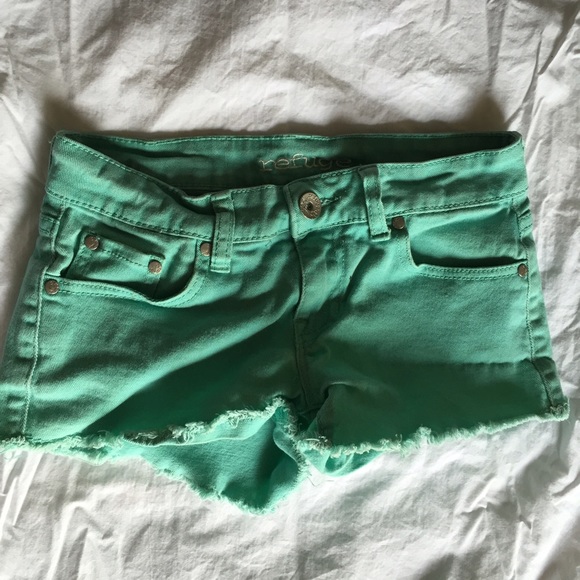 Light green denim shorts.