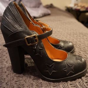 Black Mary Jane pumps with star designs