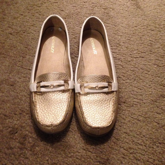 Gold and white slip on shoes