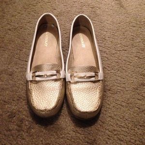 Gold and white slip on shoes