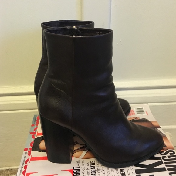 Tall dark brown leather boots