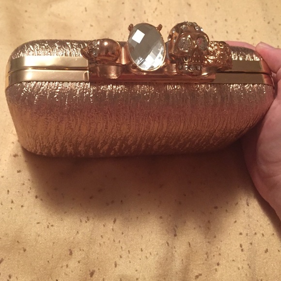 Gold textured skull clutch
