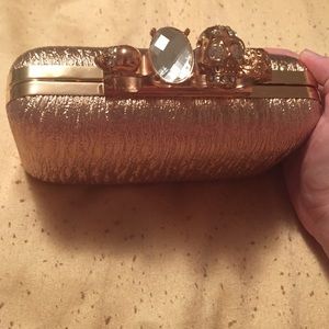 Gold textured skull clutch