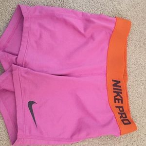 purple and orange youth small nike pro shorts
