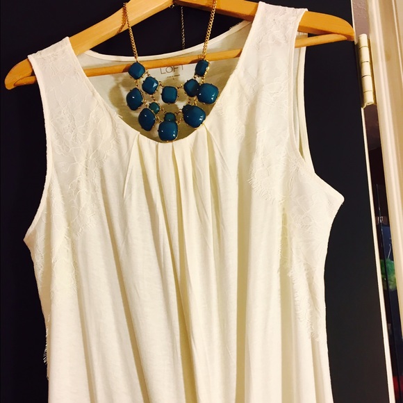 Ivory tang top.  Never been worn without tags!