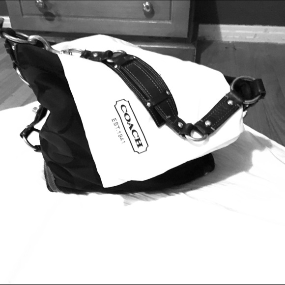 Coach Purse. Black with gold metal rings.