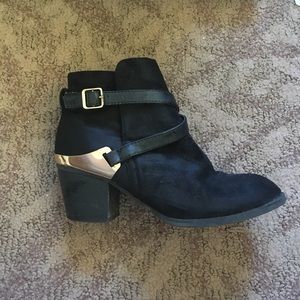 Black booties with gold accents
